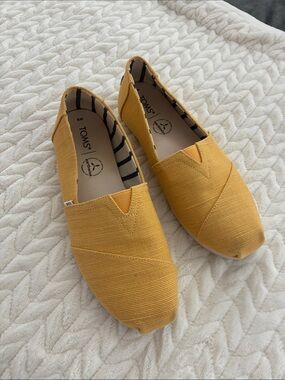 TOMS Mustard Yellow Canvas Slip-Ons